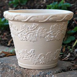 Grapeleaf Planter (9-inch): 9-inch round polyurethane planter with an antiqued sandstone finish and a design of grape leaves in relief.